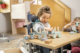 Child with a disability plays in a Schuchmann therapy chair